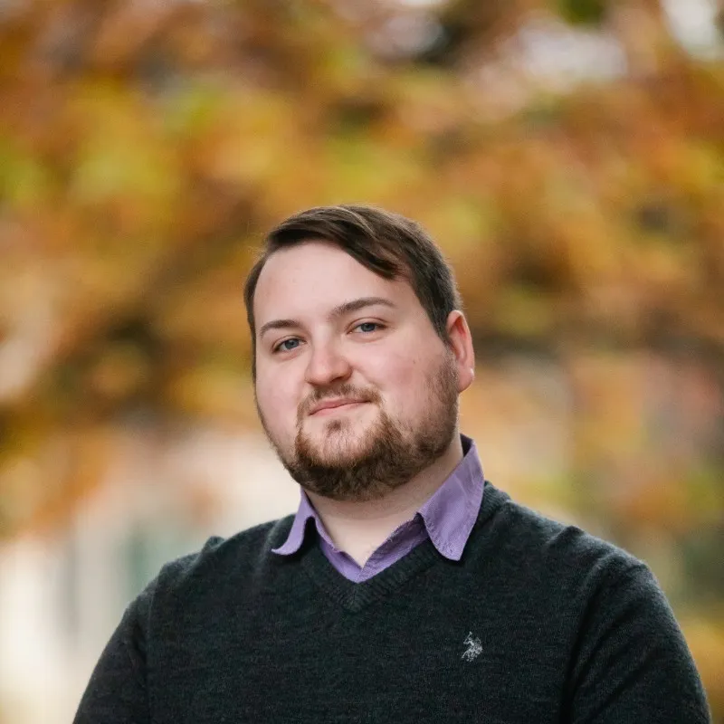 Alex Cooper's headshot